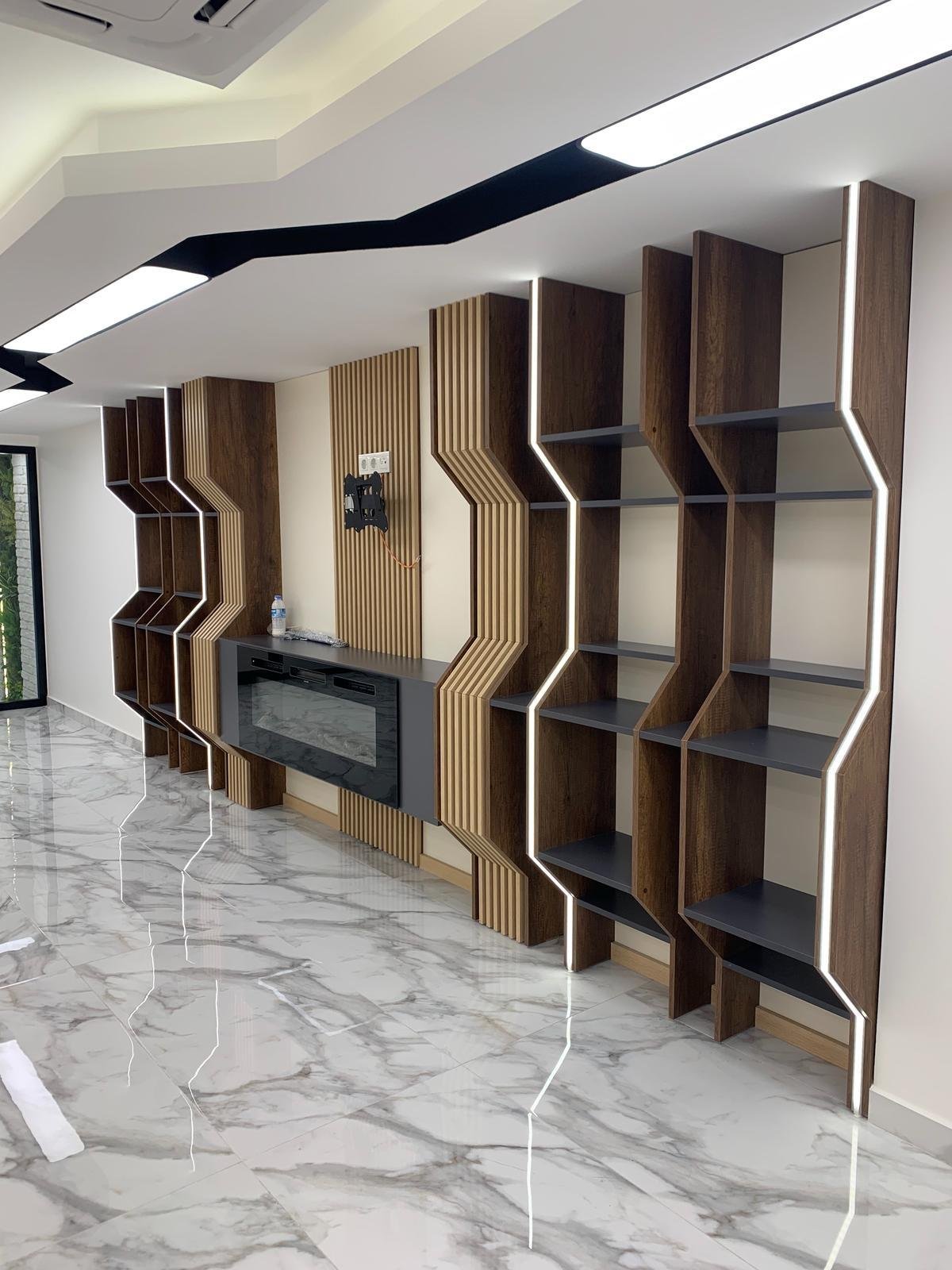 Custom wall unit with integrated fireplace and LED-lit shelving